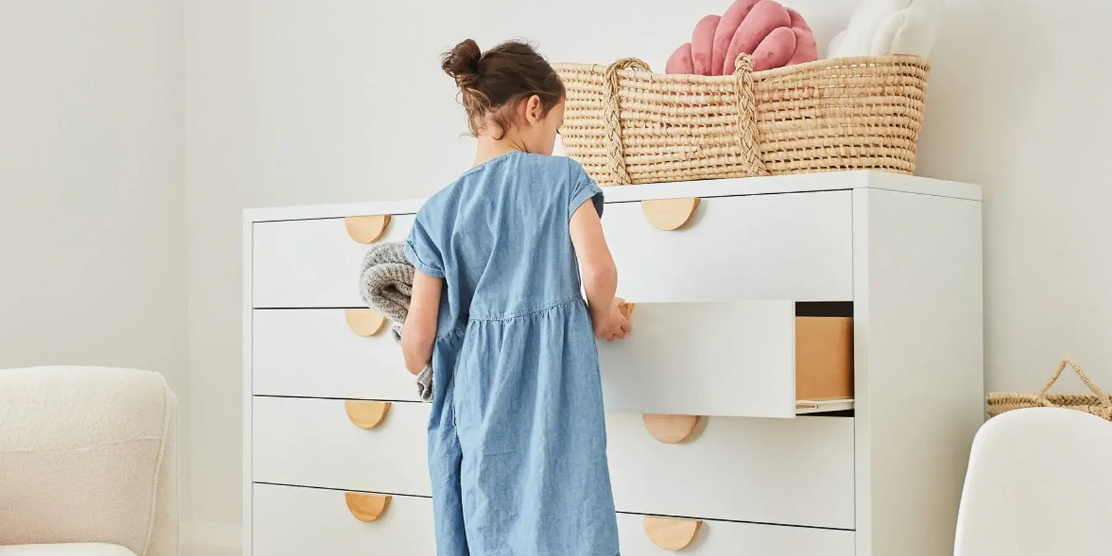 kid in front of a white furniture