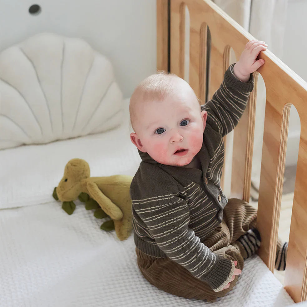 baby in cot in nursery