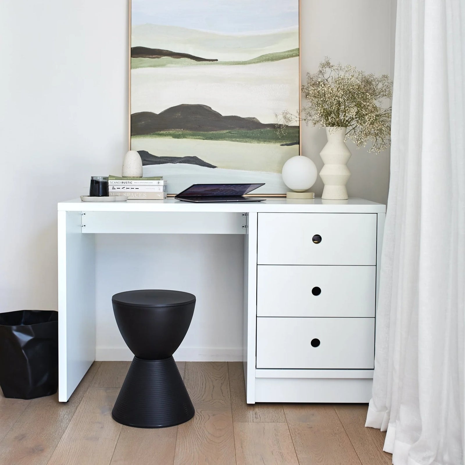 white desk with black stool