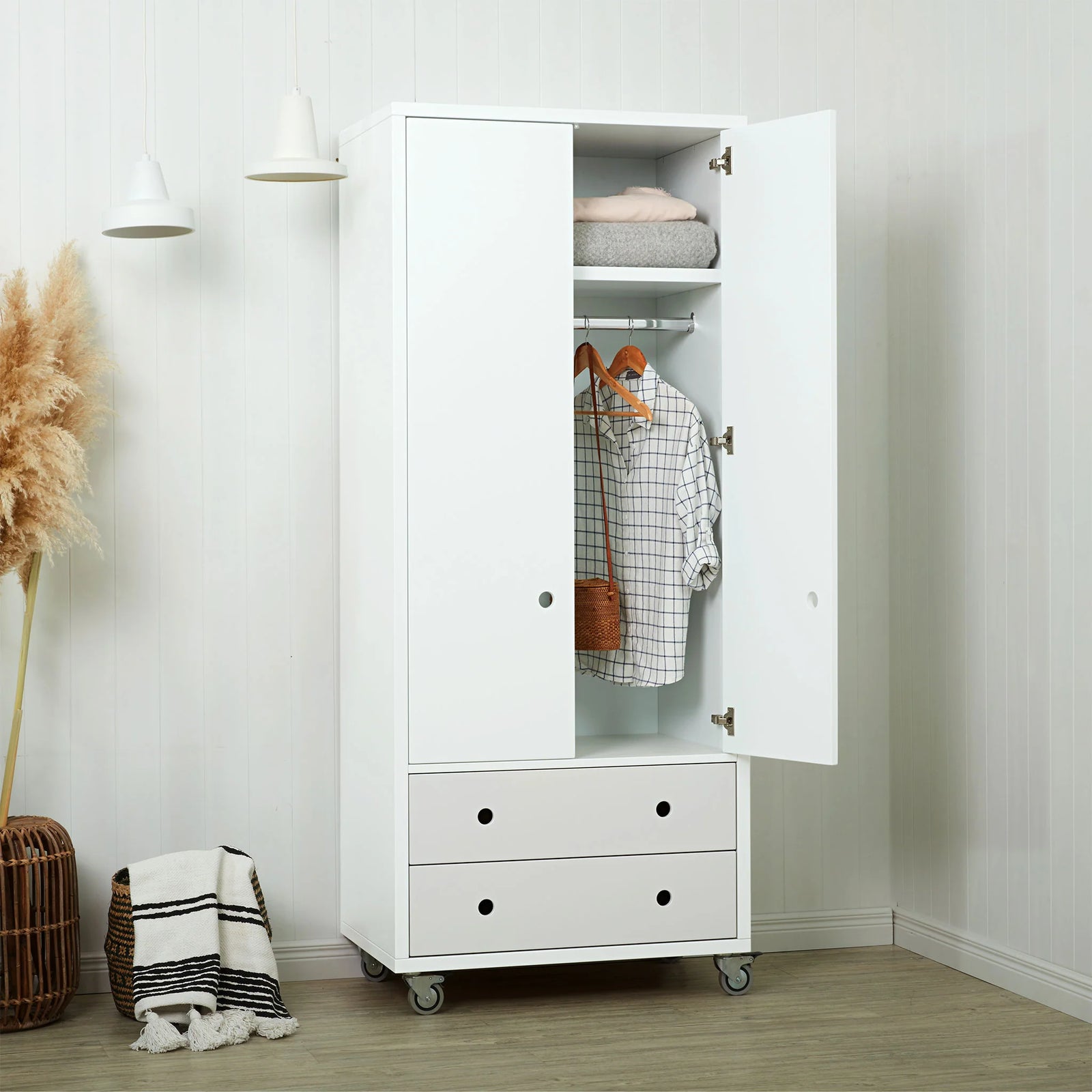 Wadrobe with hanging clothes and storage drawers